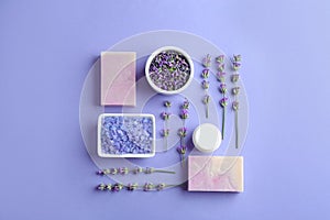 Flat lay composition with hand made soap bars and lavender flowers on background