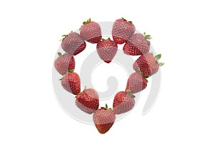 Flat lay composition in hart shape with fresh strawberries isolated on white background. Flat lay pattern, top view. photo