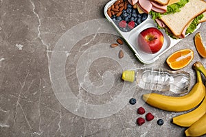 Flat lay composition with healthy food and space for text on table. School lunch