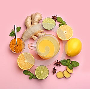 Flat lay composition with immunity boosting drink and ingredients on pink background