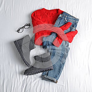 Flat lay composition with jeans, sweater and shoes