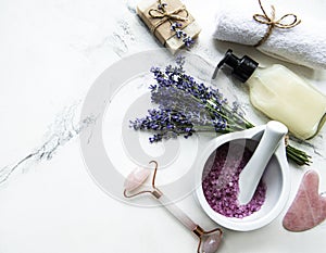 Flat lay composition with lavender flowers and natural cosmetic