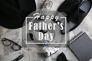 Flat lay composition of male accessories and gift boxes on grey stone background. Happy Father`s day