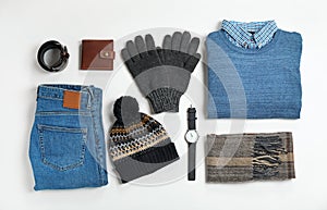 Flat lay composition with male winter clothes on white