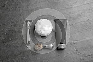 Flat lay composition with men`s cosmetic products on grey background.
