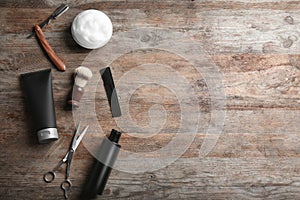 Flat lay composition with men`s cosmetic products on wooden background