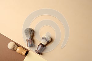 Flat lay composition with men`s shaving brushes and space for text