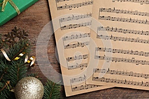 Flat lay composition with music sheets on wooden background. Christmas celebration