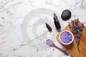 Flat lay composition with natural cosmetic products and lavender flowers on background. Space for text