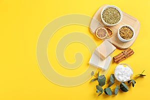 Flat lay composition with natural handmade soap and ingredients on background. Space for text