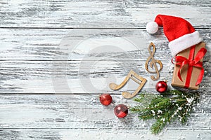 Flat lay composition with notes on white wooden background. Christmas music concept