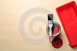 Flat lay composition with paint can and brush on wooden background