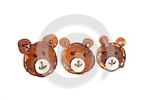 Flat lay composition with pancakes in form of bear isoleted on white background. Creative breakfast ideas for kids photo