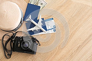 Flat lay composition with passport, toy plane and tickets on white wooden background, space for text. Visa receiving.