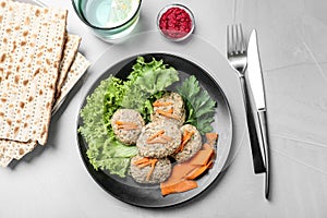 Flat lay composition with plate of traditional Passover Pesach gefilte fish