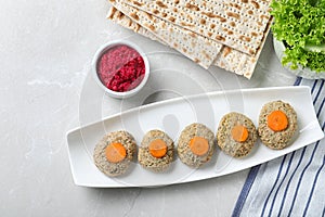 Flat lay composition with plate of traditional Passover Pesach gefilte fish