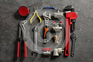 Flat lay composition with plumber`s tools