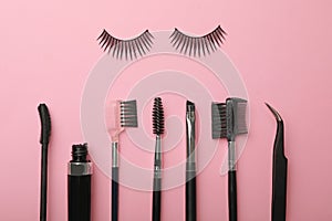 Flat lay composition of professional makeup tools and false eyelashes