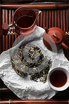 Flat lay composition with pu-erh tea on wooden tray. Traditional ceremony