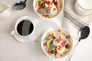 Flat lay composition with quinoa porridge and coffee on wooden background.