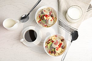 Flat lay composition with quinoa porridge and coffee on wooden background