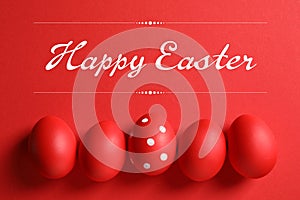 Flat lay composition of red painted eggs and text Happy Easter