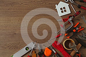 Flat lay composition with repair tools on wooden table