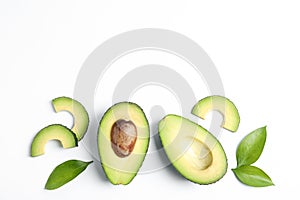 Flat lay composition with ripe avocados on white background, space for text