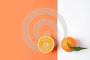 Flat lay composition with ripe tangerines on color background.