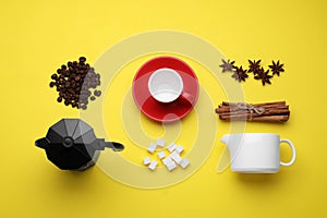 Flat lay composition with roasted beans and geyser coffee maker on yellow background