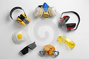 Flat lay composition with safety equipment and space for text on white