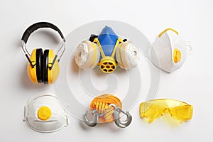 Flat lay composition with safety equipment on white