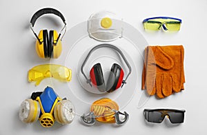 Flat lay composition with safety equipment on white