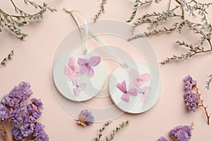 Flat lay composition with scented sachets on pink background