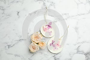 Flat lay composition with scented sachets on white marble table