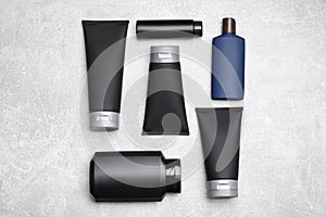 Flat lay composition with set of men`s cosmetic products on light grey background