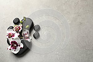 Flat lay composition with spa stones and orchid flowers