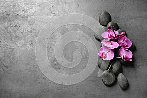 Flat lay composition with spa stones and orchid flowers