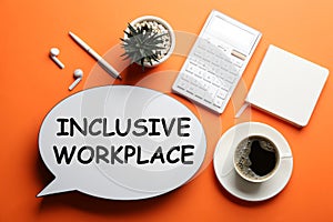 Flat lay composition of speech bubble lightbox with phrase INCLUSIVE WORKPLACE on orange background