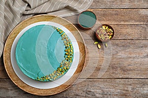 Flat lay composition with spirulina on wooden table. Space for text