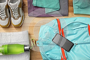 Flat lay composition with sports bag on background