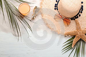 Flat lay composition with stylish hat and beach objects