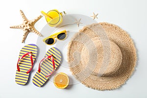 Flat lay composition with summer vacation accessories on white background, top view