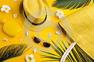 Flat lay composition with sunglasses and accessories on yellow background