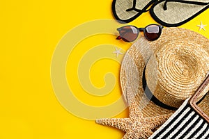 Flat lay composition with sunglasses and accessories on yellow background. Space for text