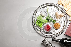 Flat lay composition with symbolic Passover Pesach items on color background