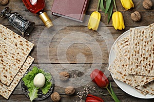 Flat lay composition with symbolic Passover Pesach items on wooden background