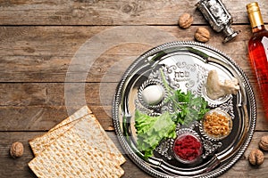 Flat lay composition with symbolic Passover Pesach items on wooden background
