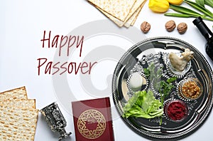 Flat lay composition of symbolic Pesach items on white. Happy Passover