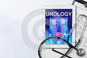 Flat lay composition with tablet, stethoscope